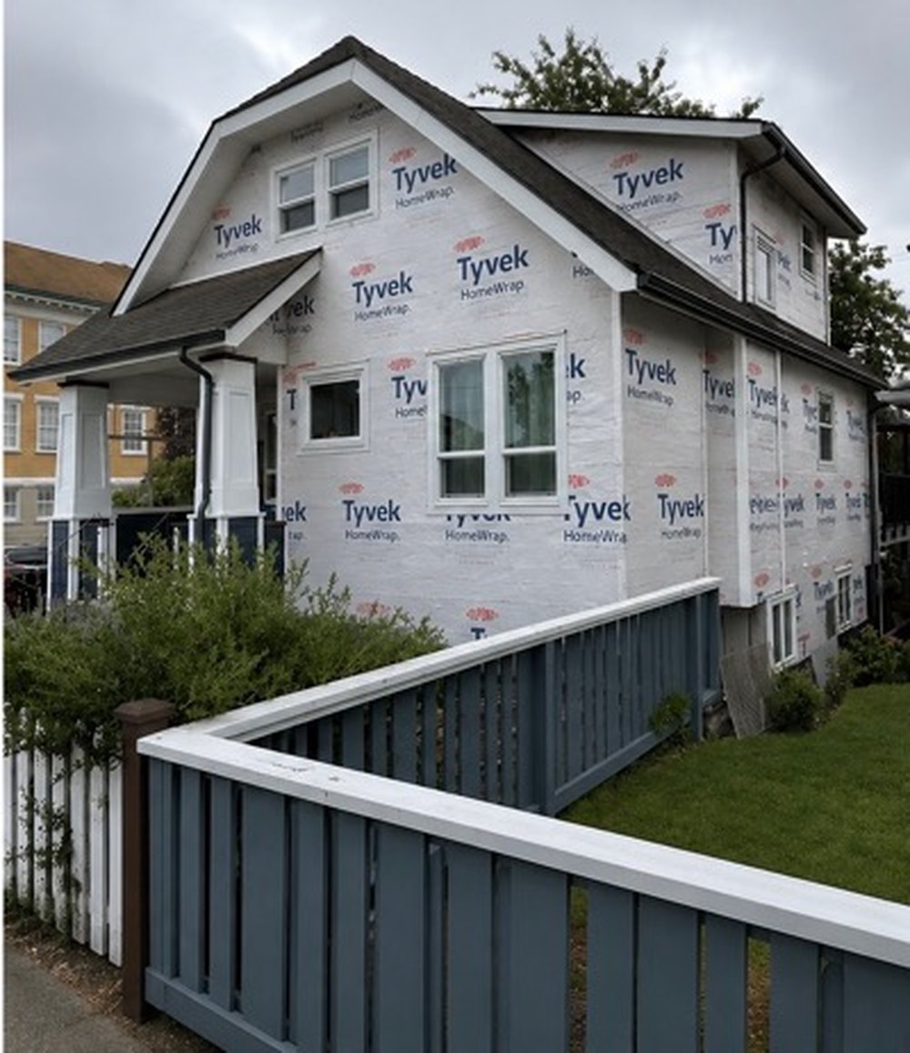 Home mid-project with weather barrier exposed